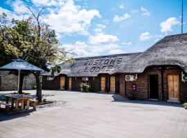 Bostons Lodge & Restaurant，位于Jan Kempdorp的山林小屋