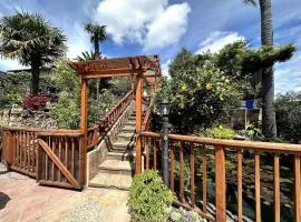 Charming Backyard Guest House with Koi Pond