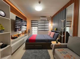 Oasis in Style at SMDC Style Residences，伊洛伊洛的有停車位的飯店