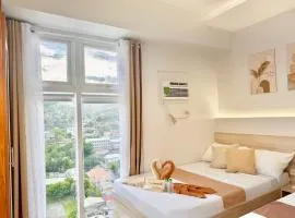 Tranquil Mountain View in Cebu City Studio unit for 1 to 4 pax with High speed WiFi Free Pool and Netflix