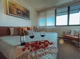Sunrise 2BR Apt Steps from the Beach with Pool View