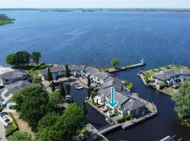 OV306 - Very nice and spacious 4 person apartment near Giethoorn on the water and private dock