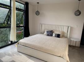 Dormitorio con baño privado es Tu descanso en el corazón de San Salvador, Hotel in San Salvador