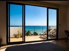 Mar Azul y Amanecer Desde la Cama