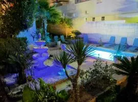 Beach Villa Apartment on top location, with pool, sea view and exotic garden