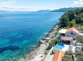 Seafront Villa Mijo by Villas Guide
