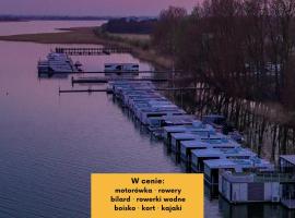 HT Houseboats - domki na wodzie - sauna, motorówka, rowerki wodne, ξενοδοχείο σε Mielno