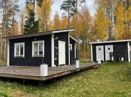 A simple stuga on a lake incinerating toilet in a separate building next to the cabin Water for drinking and washing hands dishes comes from two containers that attach to a faucet through a simple electric pump OBS no shower on site