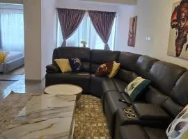 2 Bedroom Luxury Lush Living with city view, fully furnished with cozy sits, WiFi, swimming pool and gym