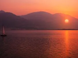 lake front house with lake view and garage