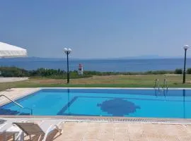Blue Pastel-cliffside villa, shared pool, wild sandy beach nearby