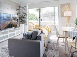 Coastal getaway, tropical palms in Dee Why