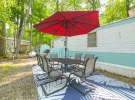 Walk to Manistee Lake Retro Cottage with Fire Pit!