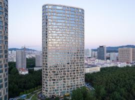 沃德酒店威海国际海水浴场火炬八街店, hotel v destinaci Wej-chaj