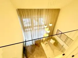 Das Alpenzeit Loft mit Balkon und Grimmingblick