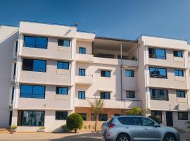 Milestone City Appartements-Pas de delestage-Restaurant-Près Tsimbazaza-Vue Palais de la Reine, apartment in Antananarivo