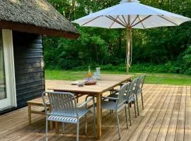 Be Surrounded By Trees In A Thatched Cottage