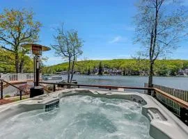 Lakefront home with kayaks fire pit hot tub and walk to restaurants and bars