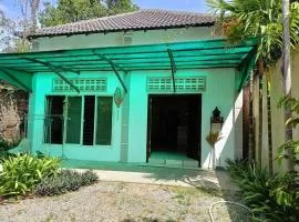 A two-bedroom home with natural light and green environment