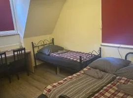 Rose Boardinghouse Zimmer mit Gemeinschaftsbad