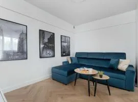 Blue and White Apartment in Łódź with Furnished Balcony by Noclegi Renters