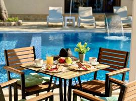 Akhdar Apartments, hotel v destinaci Utjeha