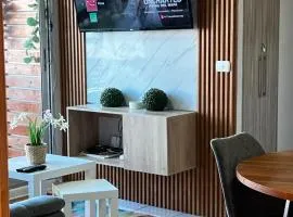 Departamento céntrico al costado de carretera 5 , aire acondicionado 9000 btu , estufa, wifi , parking privado