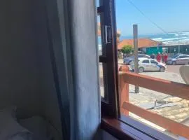 Suites e Quartos Em frente a Praia Grande -Na orla Flavia Alessandra