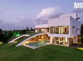 StayVista at Gardenéa with Outdoor Pool, Huge Lawn