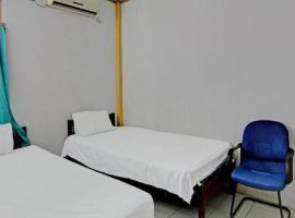 Hotel O Penginapan Aina Syariah, отель в городе Rantaupanjang