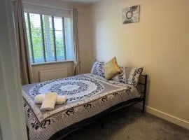 Double bedroom in a residential home with parking