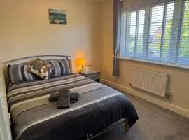 Double bedroom in a residential home with parking
