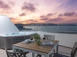 Ivory Suites Penthouse w hot tub by Homely!