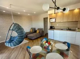 Апартамент с люлка и гледка в The House с Термална зона