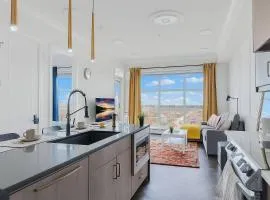 Family Stylish 2BR Condo with City View, DT, Balcony, Free Parking & In-Suite Laundry!