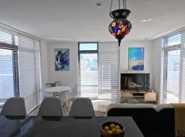Beachfront Penthouse with patio and free parking