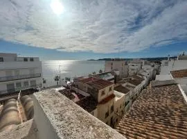 Duplex with spacious terraces and stunning sea views, right next to the beach