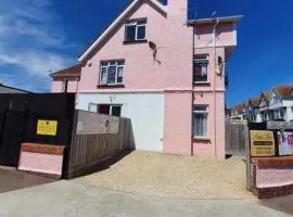 BARBIE GUEST HOUSE , On Ground Floor a 2 Bedroom Garden Apartment with Private Car Space , Opposite Paignton Pier , 2 Double Beds , 2 Single beds Kitchen & Air Fryer , Reception to Help you