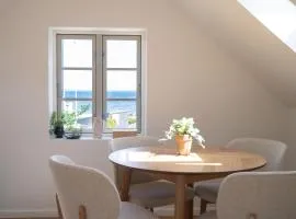 Lille villa med havudsigt og privat sauna