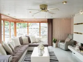 Chalet with waterfront sauna and boat