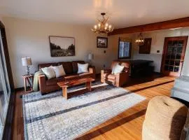 Riverfront cabin with hot tub, kayaks, dock, dog ok