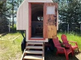 Rustic Sheep Wagon Glamping Retreat with Cowboy Ranch Views near Grand Tetons in Tetonia, Idaho
