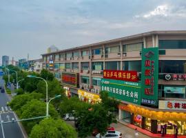 Shell Hotel Suzhou Zhangjiagang Jingang Town Central Plaza, hotel v destinaci Xiwujieqiao