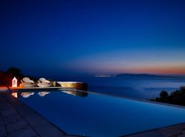 Vega Apartments, bolig ved stranden i Tinos by