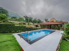 SaffronStays Silver Falls - 3BR colonial-style villa with pool, lawns, wooden bridge & monsoon waterfall views