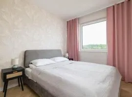 Pastel Apartment with Balcony and Parking by Noclegi Renters