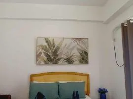 Pool View Room 333B Amani Grand Resort near Mactan Cebu Airport Free wifi, netflix, pool and gym house, 3mins to airport