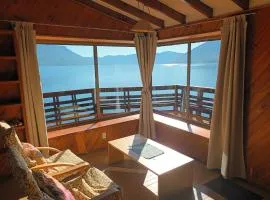 Cabaña Celeste - Acceso directo a playa lago Caburgua y cancha de tenis - direct access Beach in Caburgua Lake and tenis court
