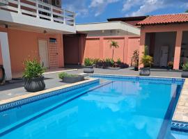 Casa Rosa Su&iacute;tes 5 min de caminhada da PRAIA DA PONTA NGRA，馬瑙斯的海灘飯店