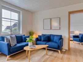 Lüttje Ginsterhuus - Ferienwohnung Käptn Pep, pet-friendly hotel in Norderney